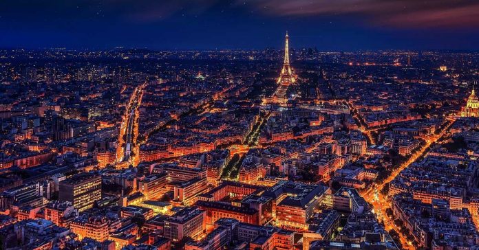 A view of Paris lights at night during the Summer. www.aTRAVELthing.com