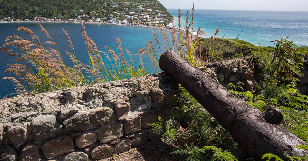 View of a old cannon and distance beaches at Scott's Head in Dominica